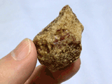 unrefined brown sugar, a piece